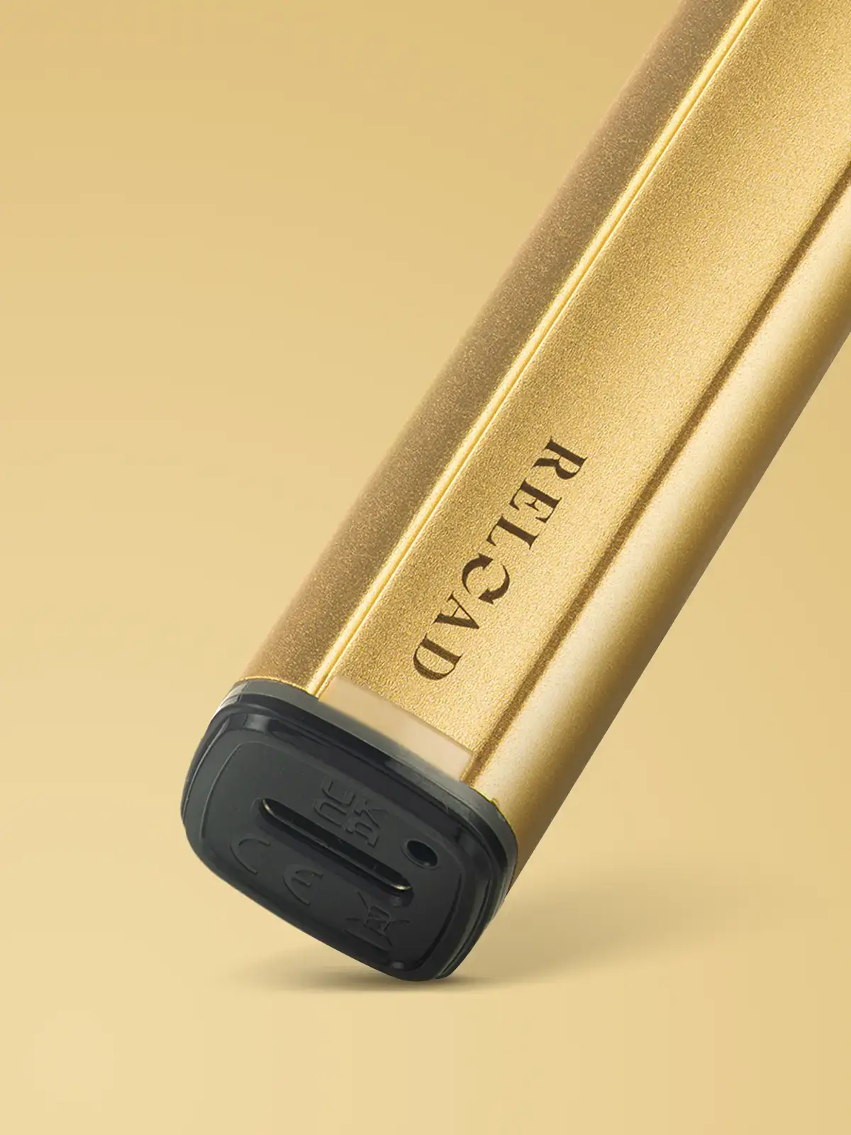 A zoomed-in shot of the Gold Bar Reload device showing the USB port on the bottom