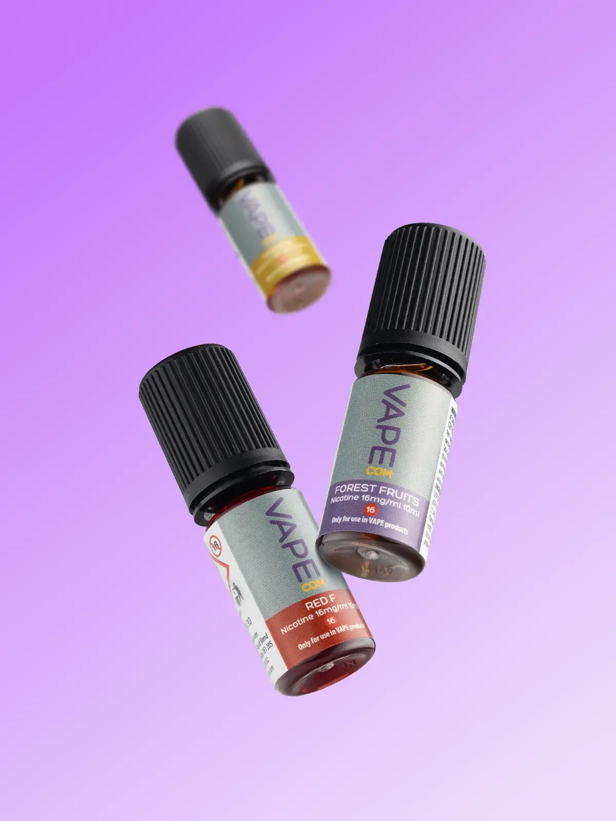 Three bottles of VapeCOM e-liquid including Red F and Forest Fruits, floating in front of a purple background