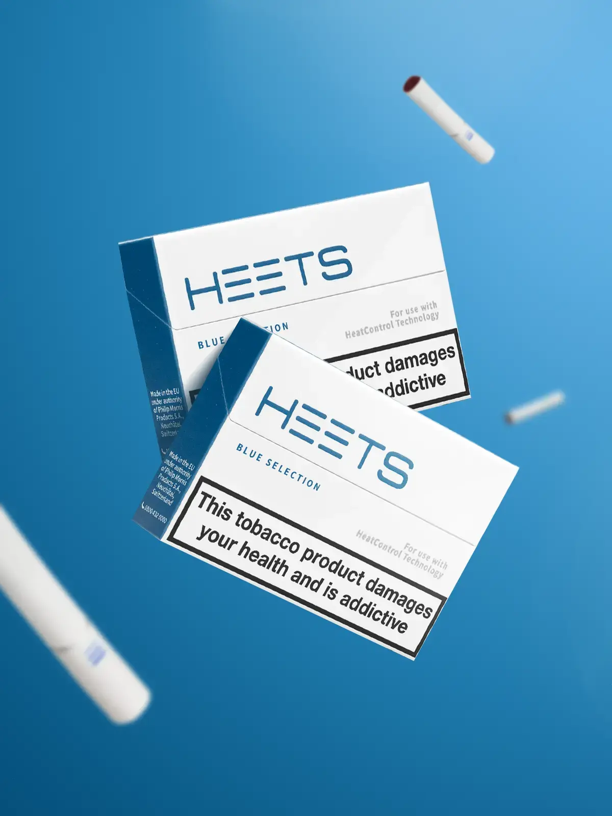 Two packs of IQOS HEETS Blue along with some loose HEETS Sticks floating in front of a blue background